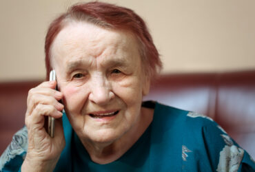 Elderly lady talking on a mobile phone